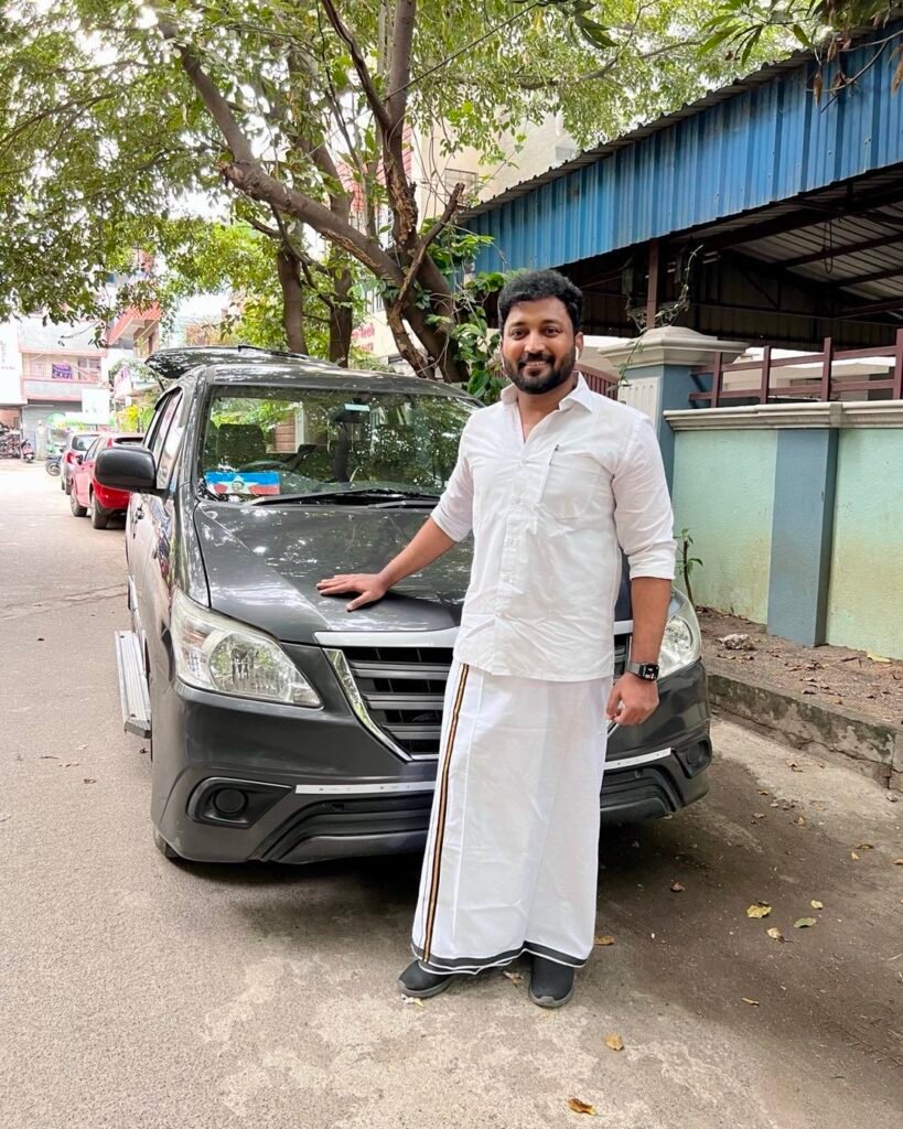 Vikraman with his car